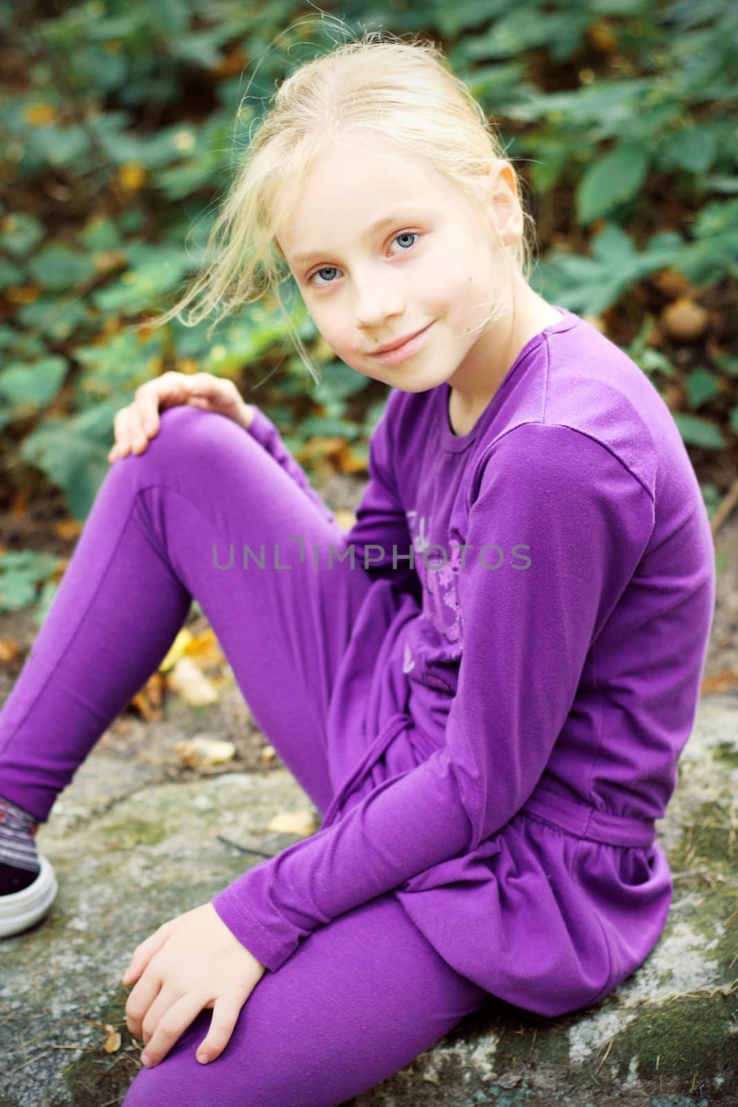 Portrait of Little Girl in Autumn Park