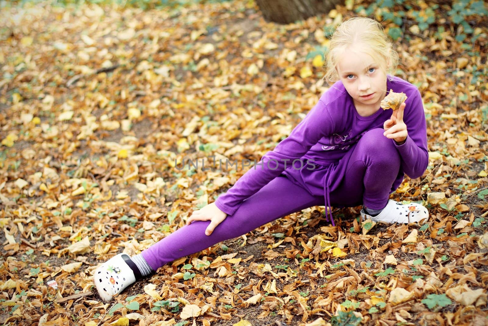 Portrait of Little Girl in Autumn Park