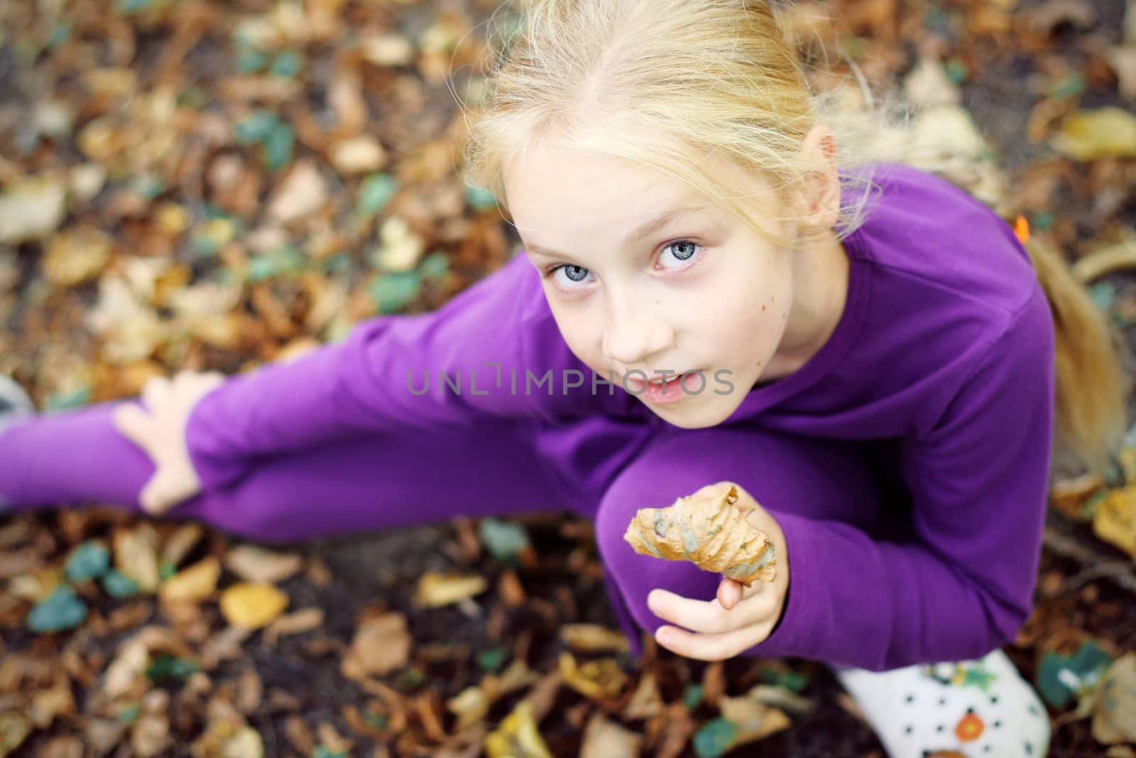 Portrait of Little Girl in Autumn Park