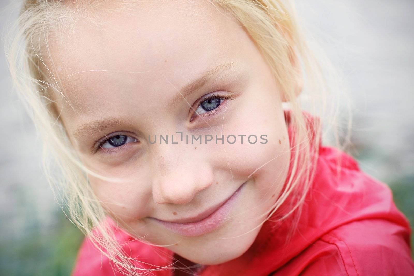 Portrait of Little Girl in Autumn Park