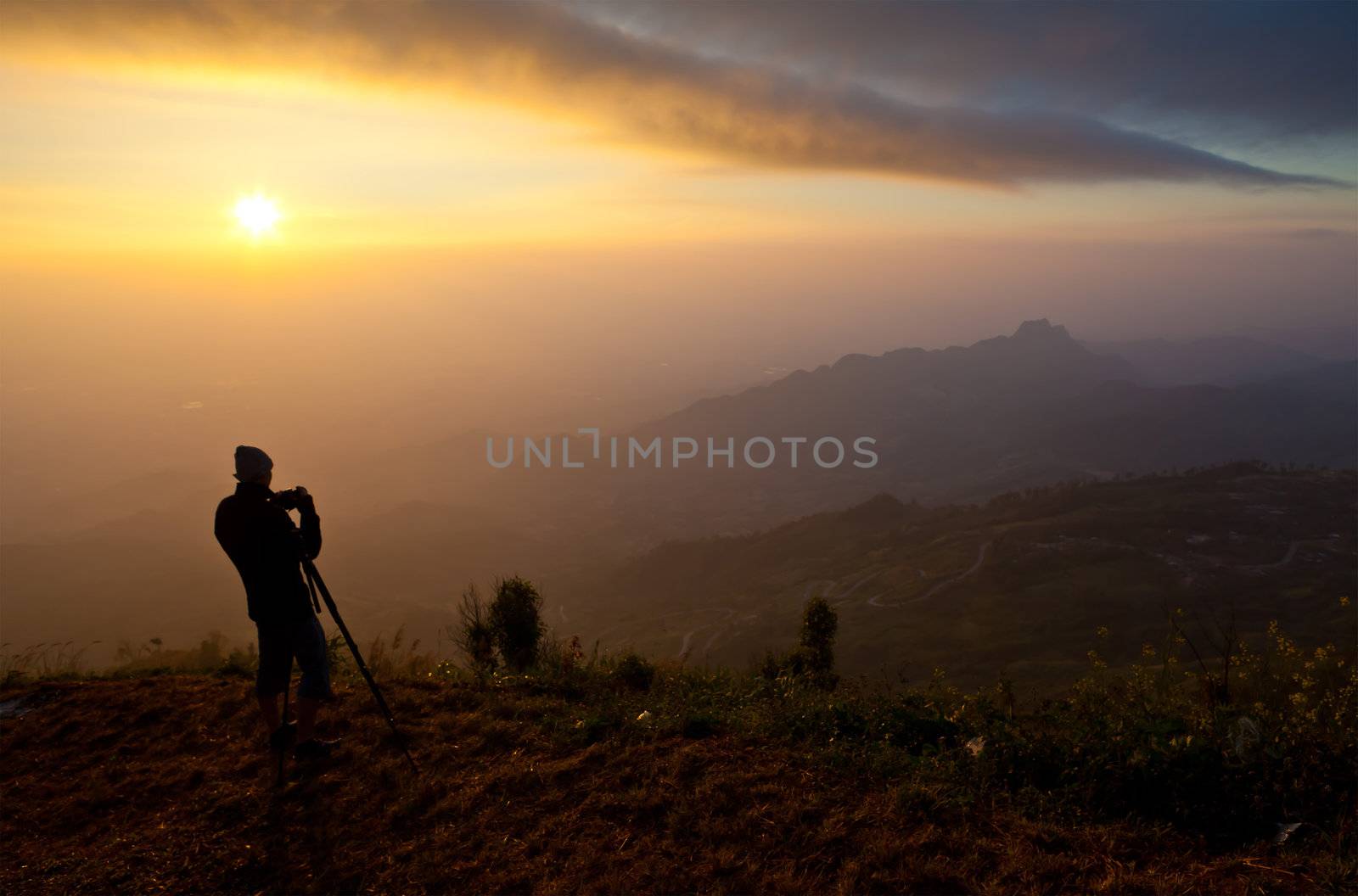 silhouette of photographer on the Mountain