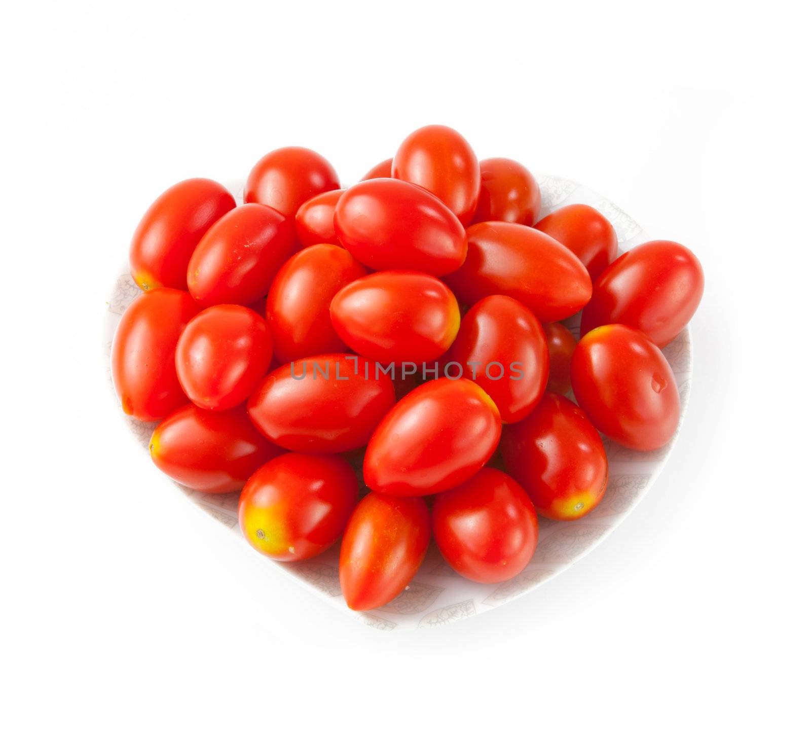 Small tomato on white background