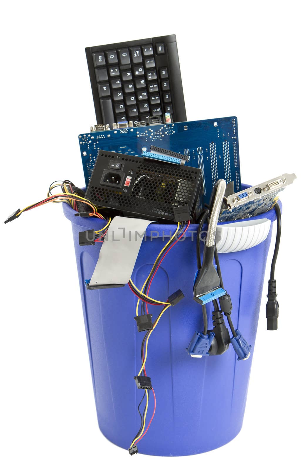 electronic scrap in trash can. keyboard, cables, logicbaord, power supply