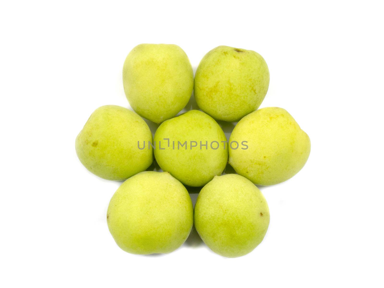 Fresh green plum in flower shape isolated