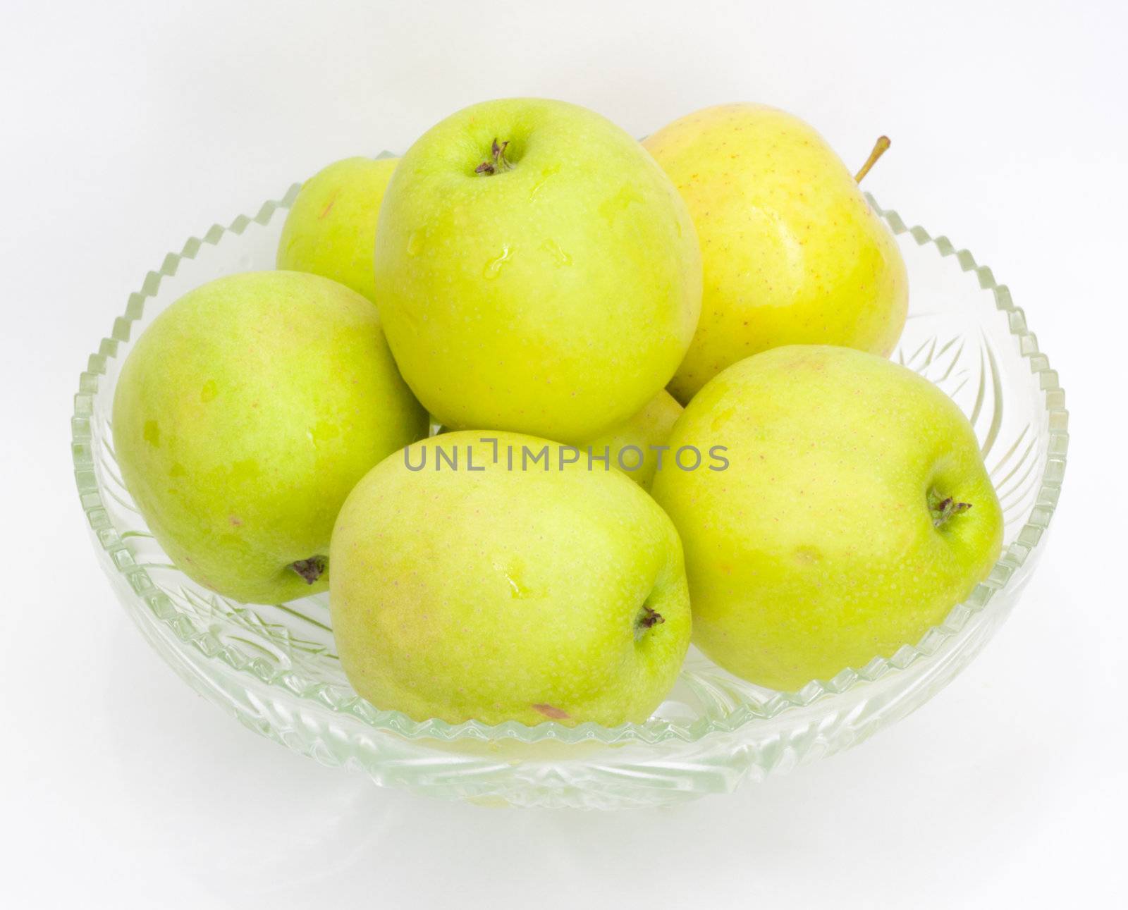 green apples in a glass jar by schankz