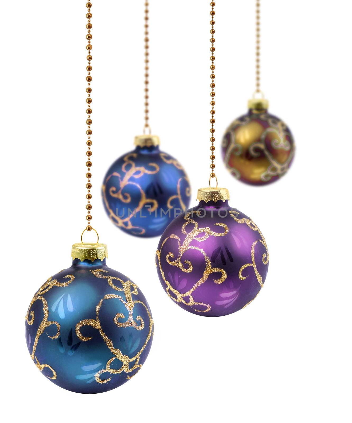 Four retro color Christmas balls hanging on white background isolated