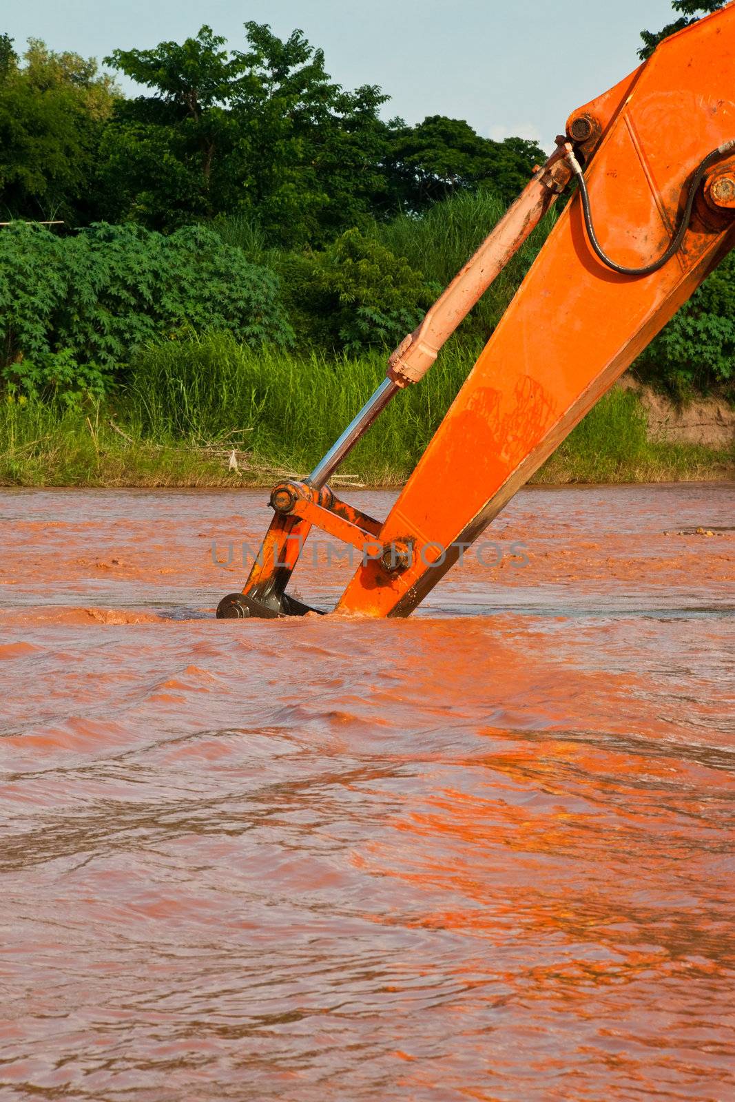 excavator loader machine during earthmoving works outdoors by Yuri2012