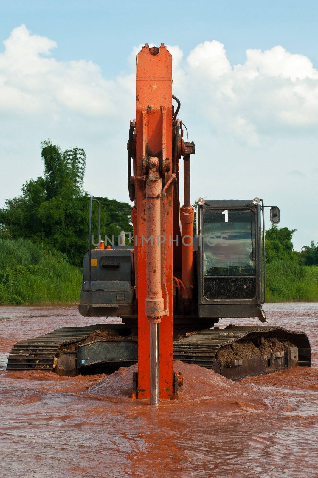 excavator loader machine during earthmoving works outdoors