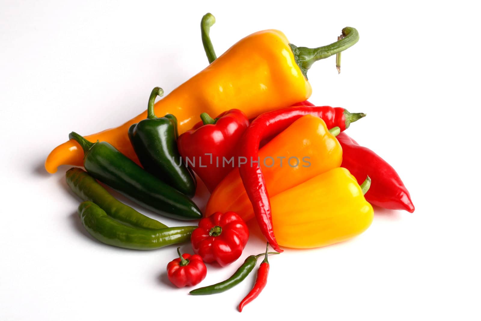 various peppers on white background