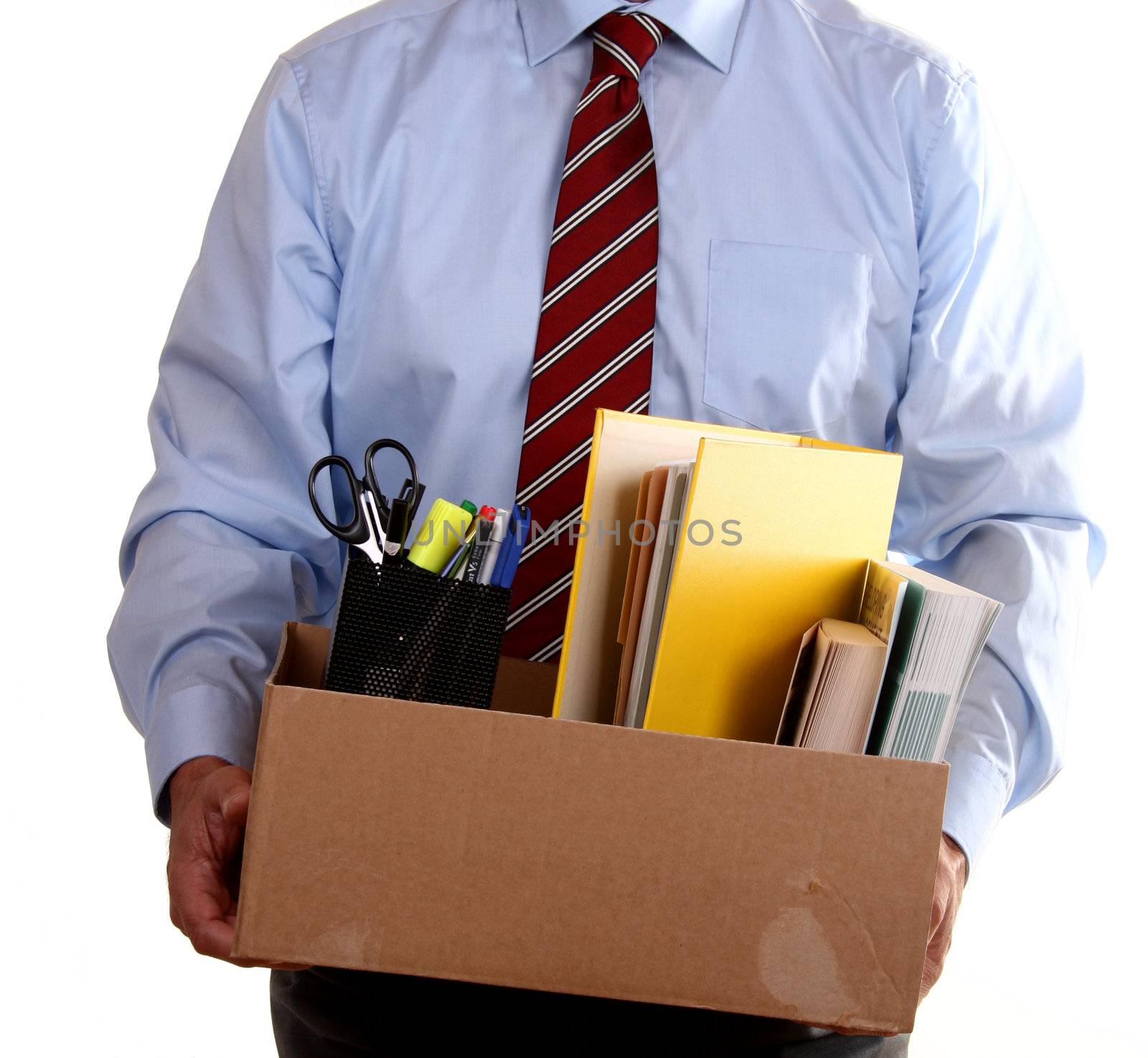 Businessman with his office belongings after losing his job