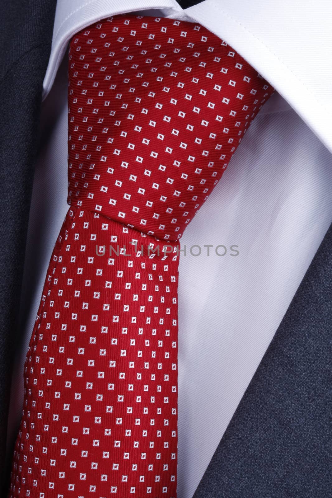 classic red tie on white shirt and gray suit - concept for businessman