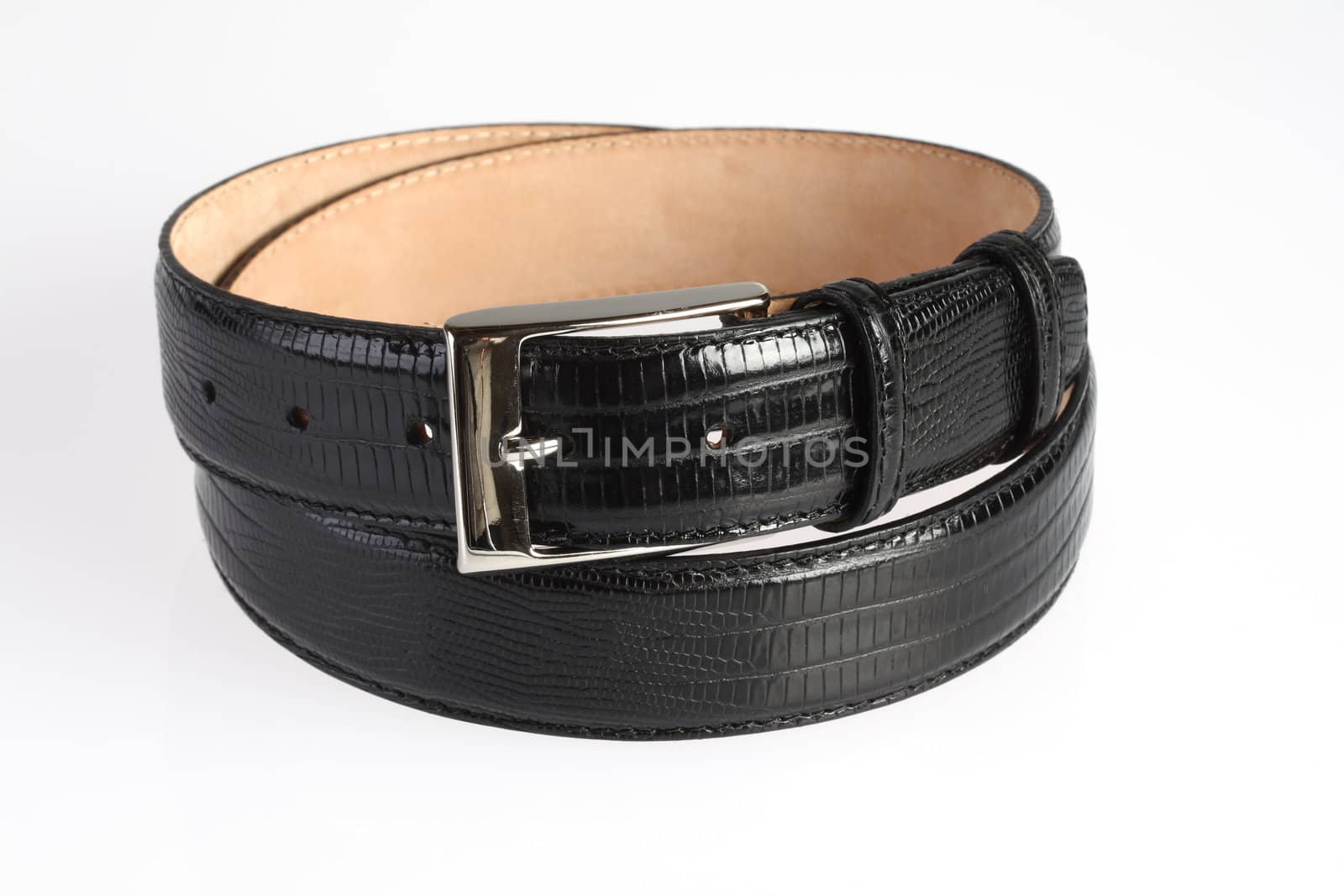 Black leather belt with crocodile print on white background