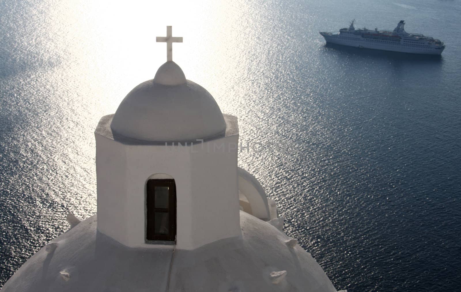 Greek Orthodox church on Santorini with cruise ship in background