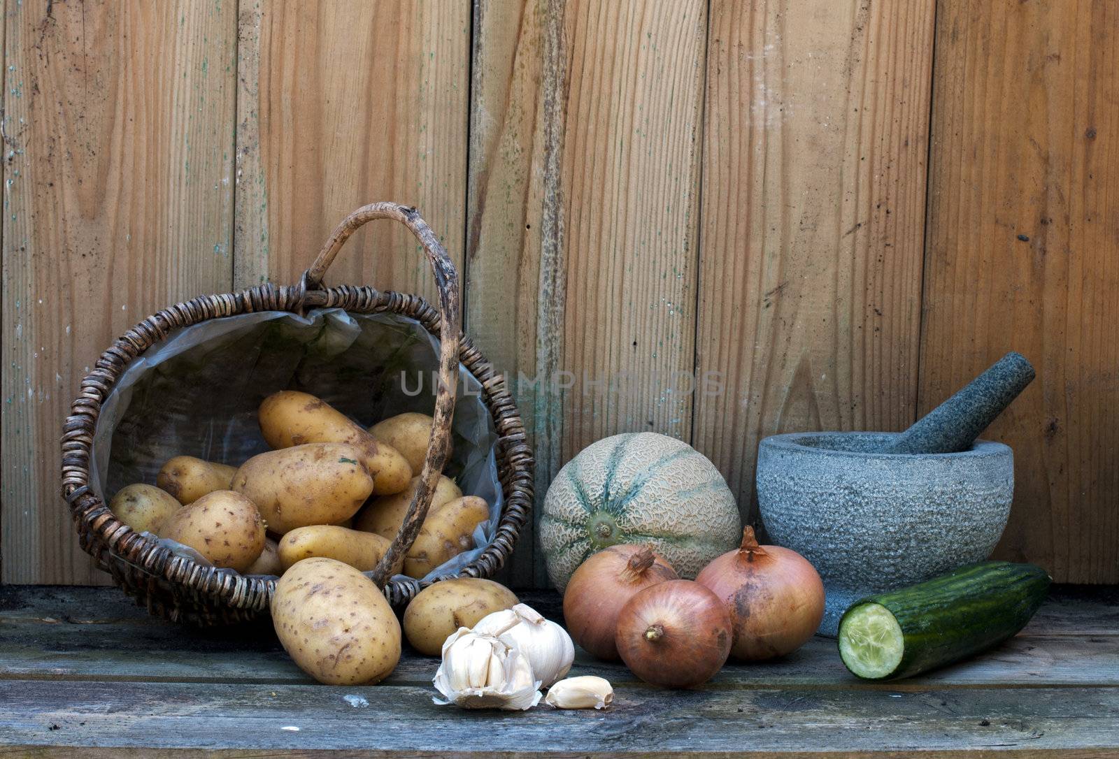 stil life with patatoes onions and others