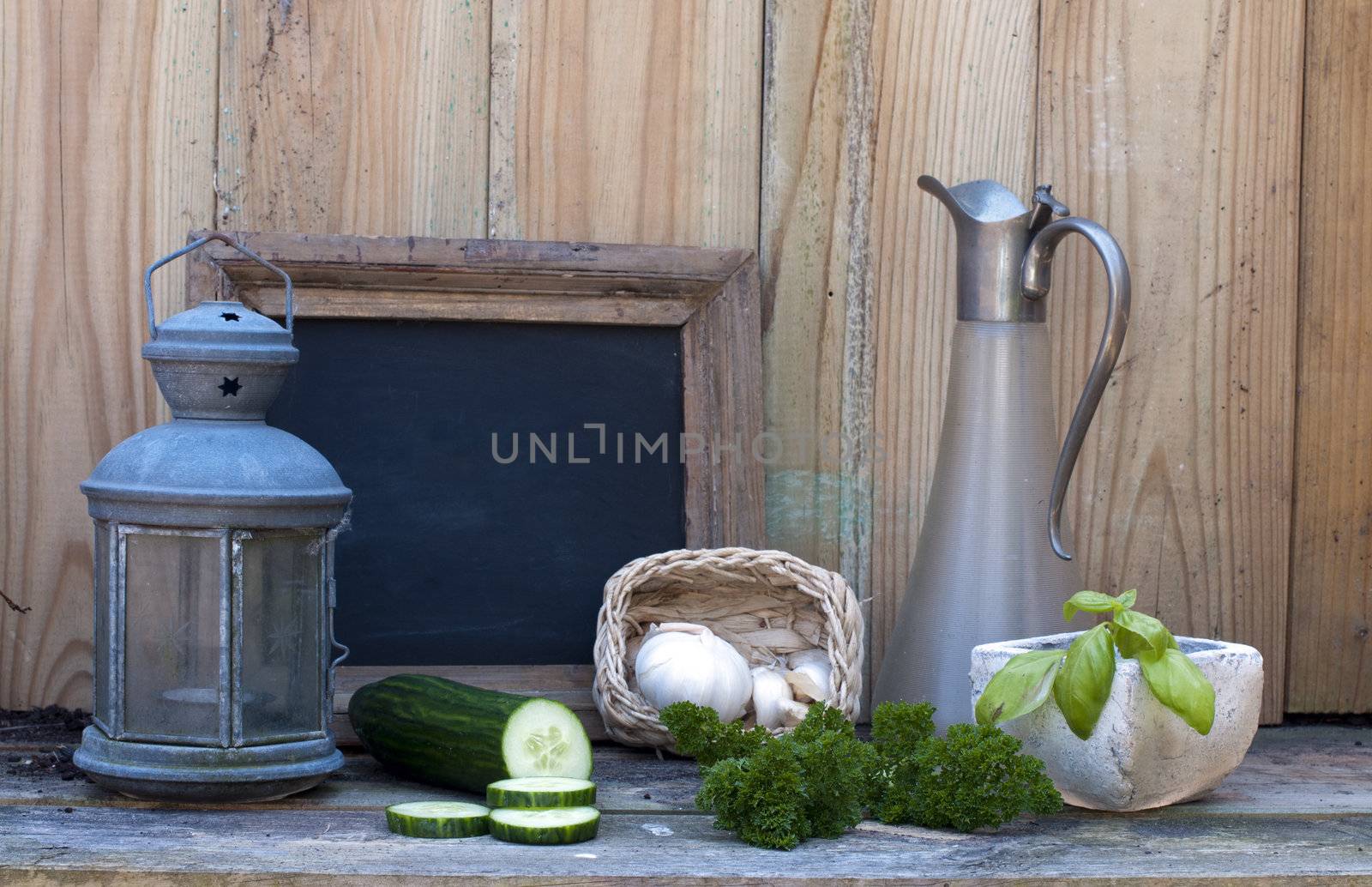 still life with light and school board garlic and cucumber