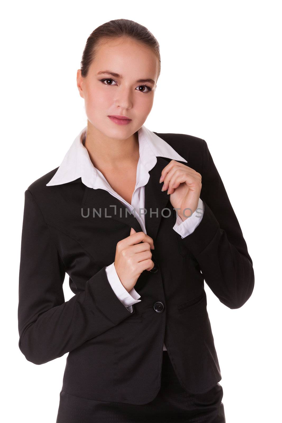 Young serious businesswoman in black suit. Isolated on white background.