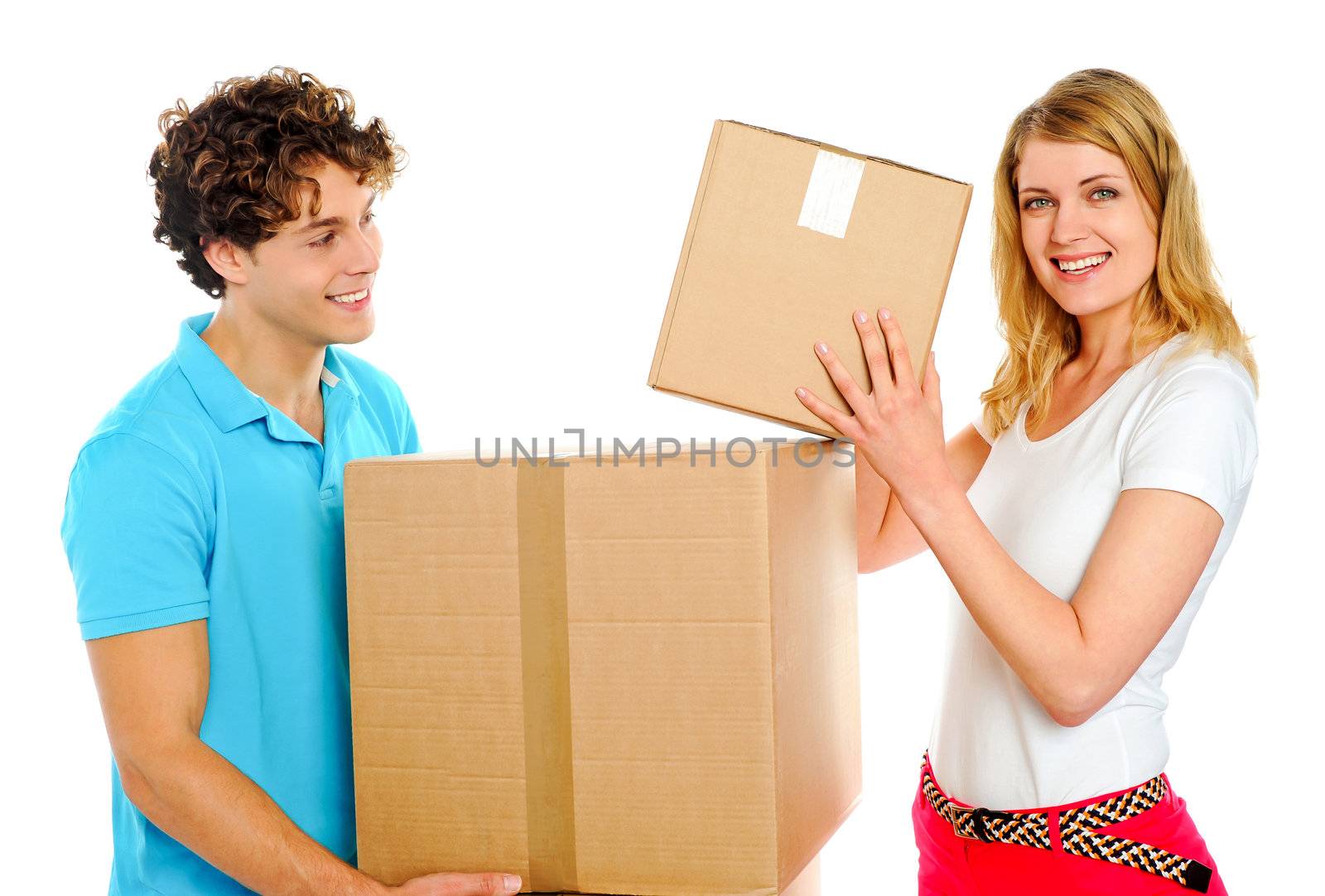 Woman arranging boxes while her boyfriends holds them