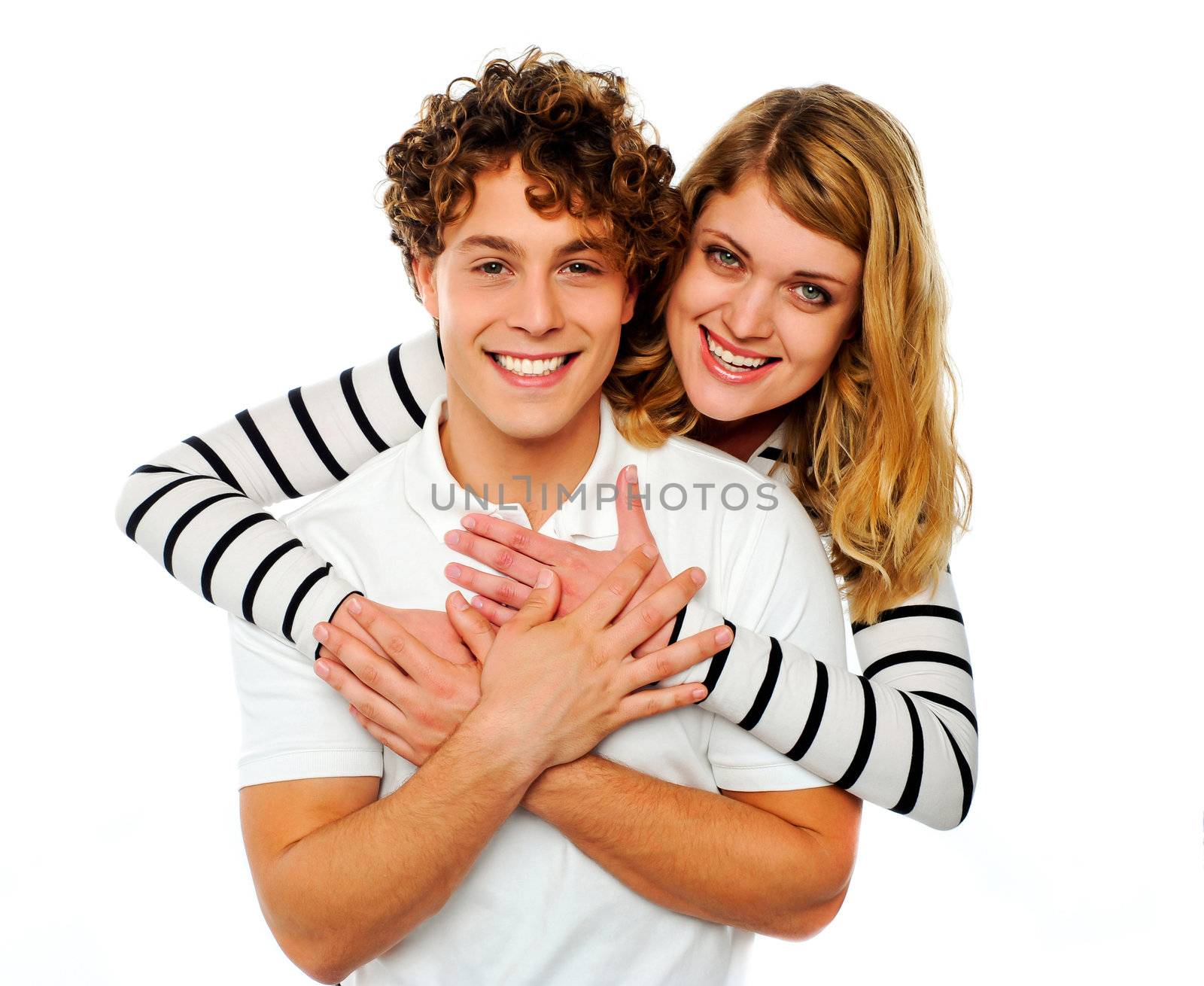 Loving couple embracing isolated over white background