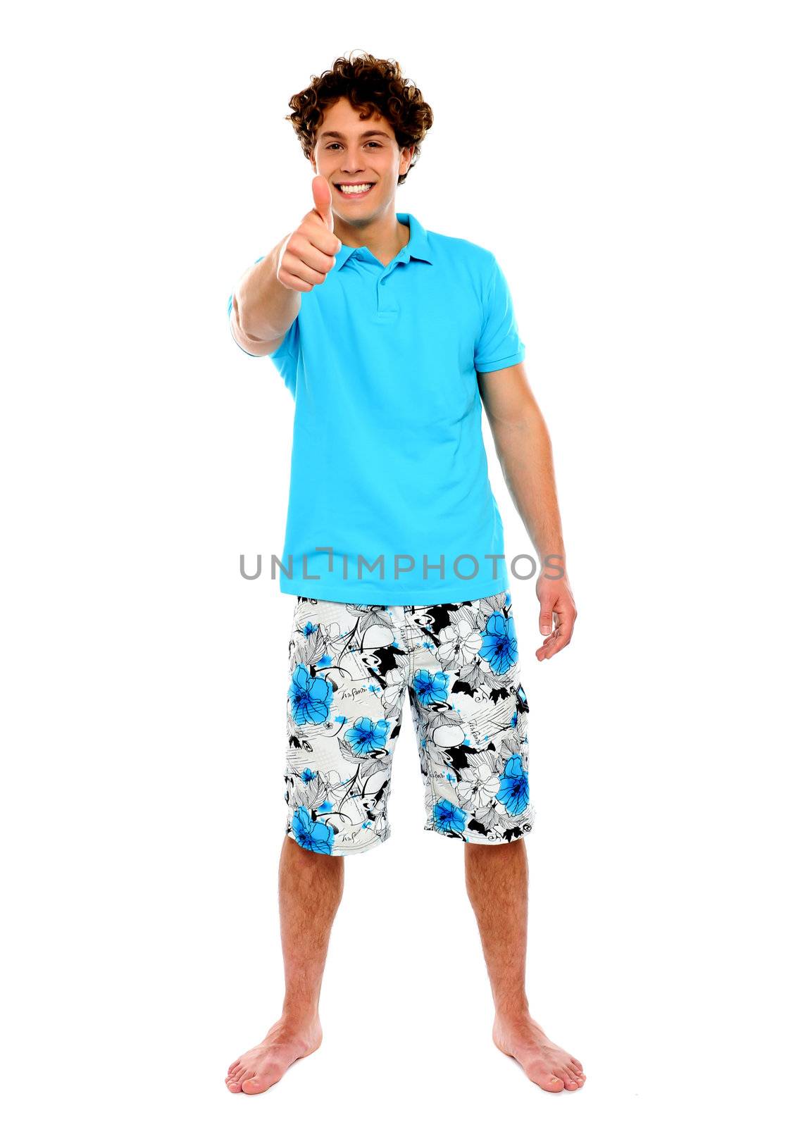 Thumbs-up from a casual guy. Isolated over white