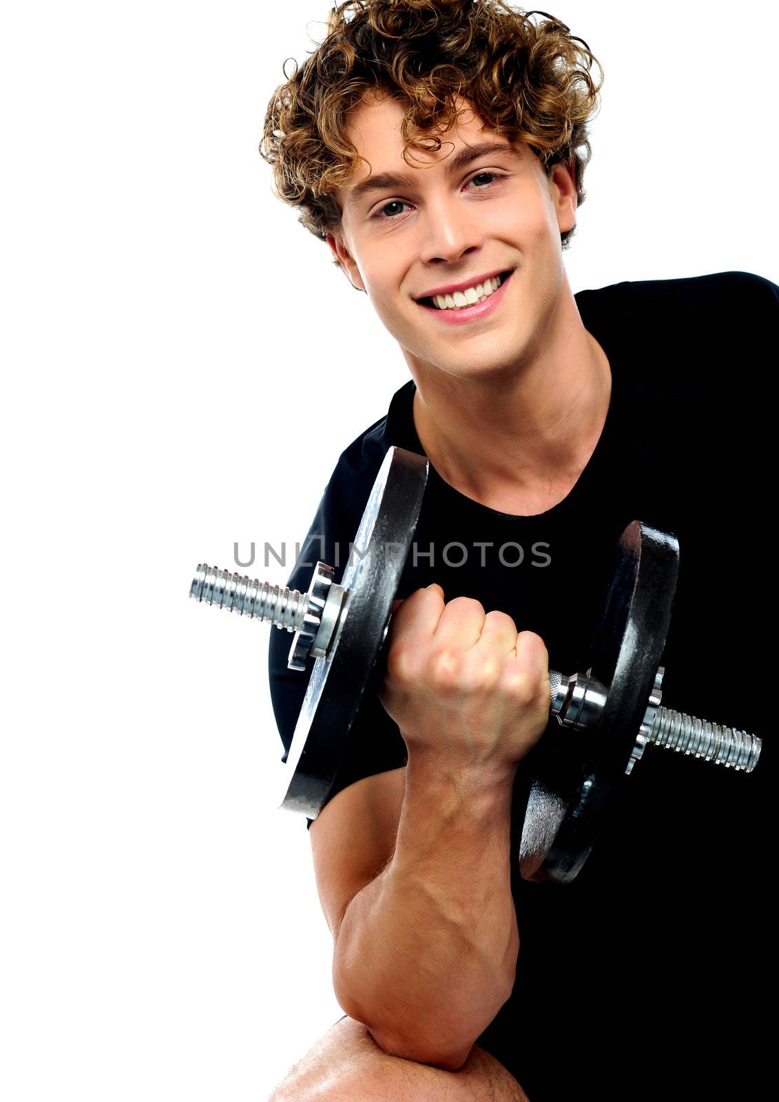 Smiling athlete doing exercise with dumbbell