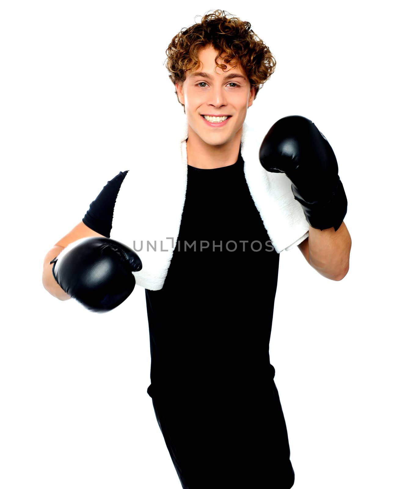 Handsome boxer posing with boxing gloves against white background