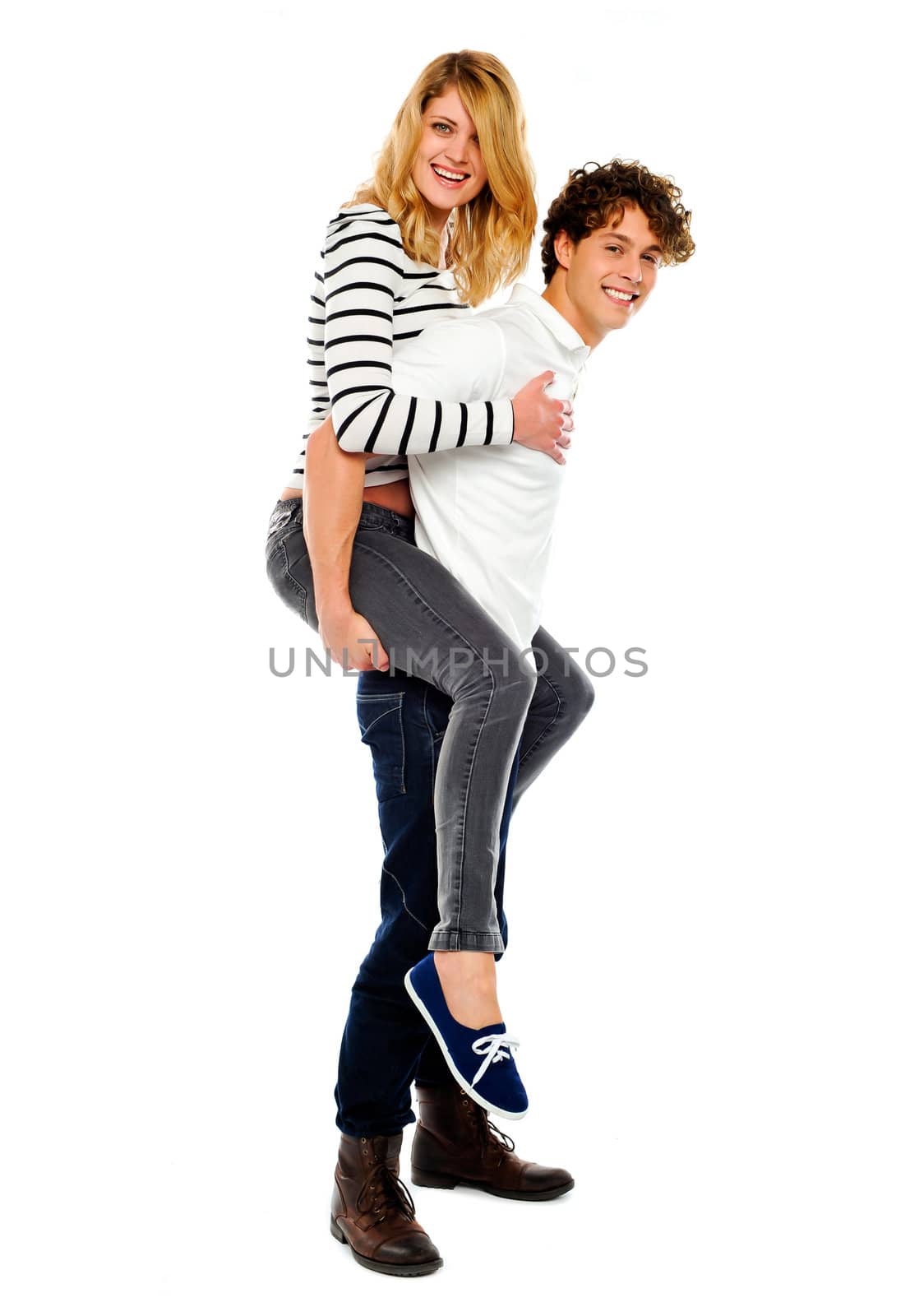 Boyfriend giving piggy ride to his girl isolated on white background