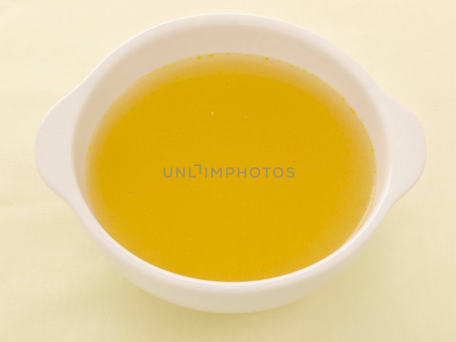 close up of a bowl of chicken broth