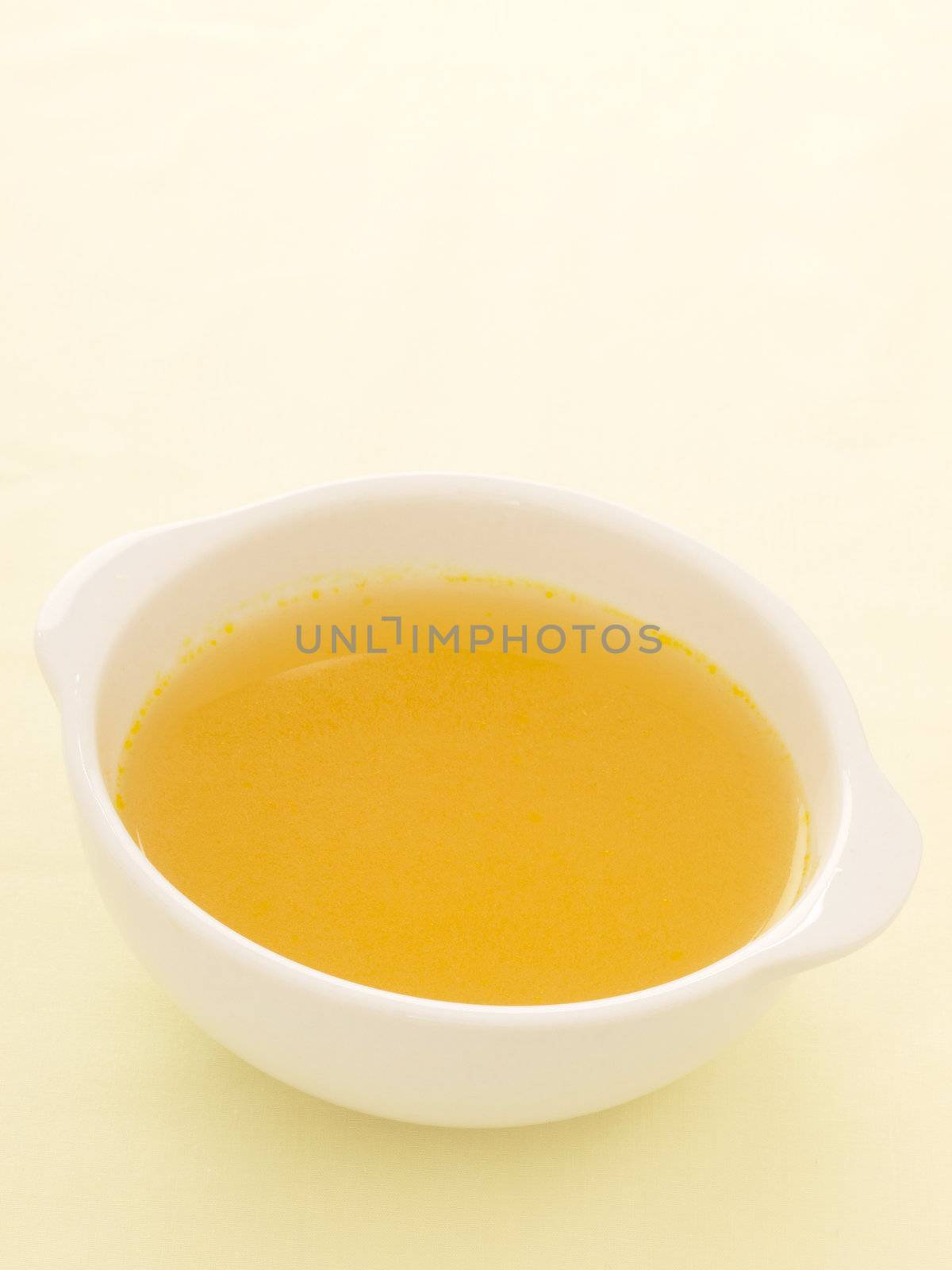 close up of a bowl of chicken broth