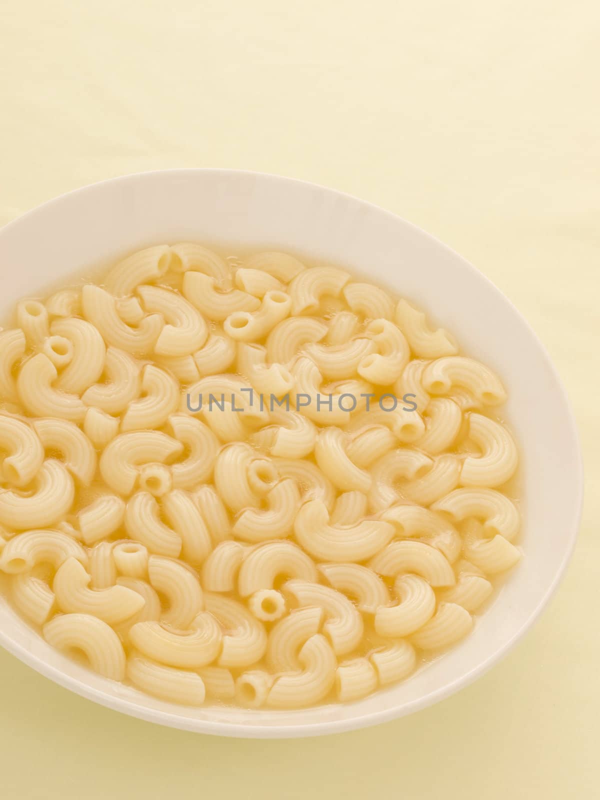 close up of a bowl of macaroni soup