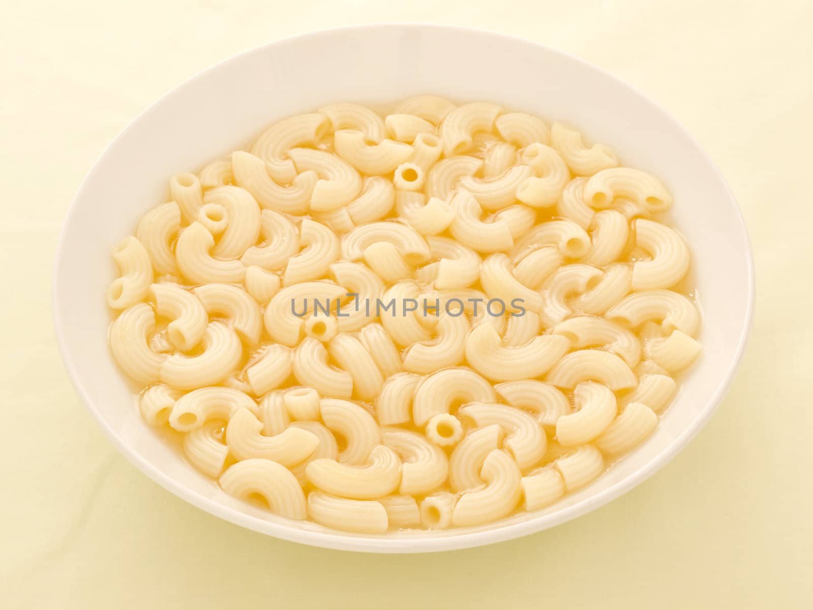 close up of a bowl of macaroni soup