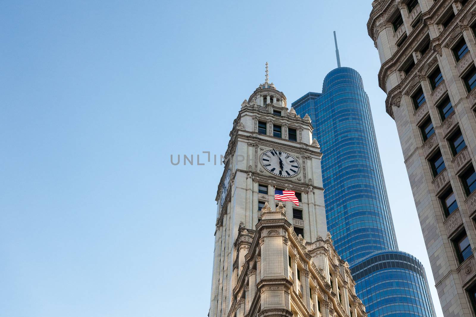 CHICAGO - MAY 14: Trump Tower looms behind Wrigley Building in Chicago on May 14, 2012. Trump Tower tops out at 1389 feet