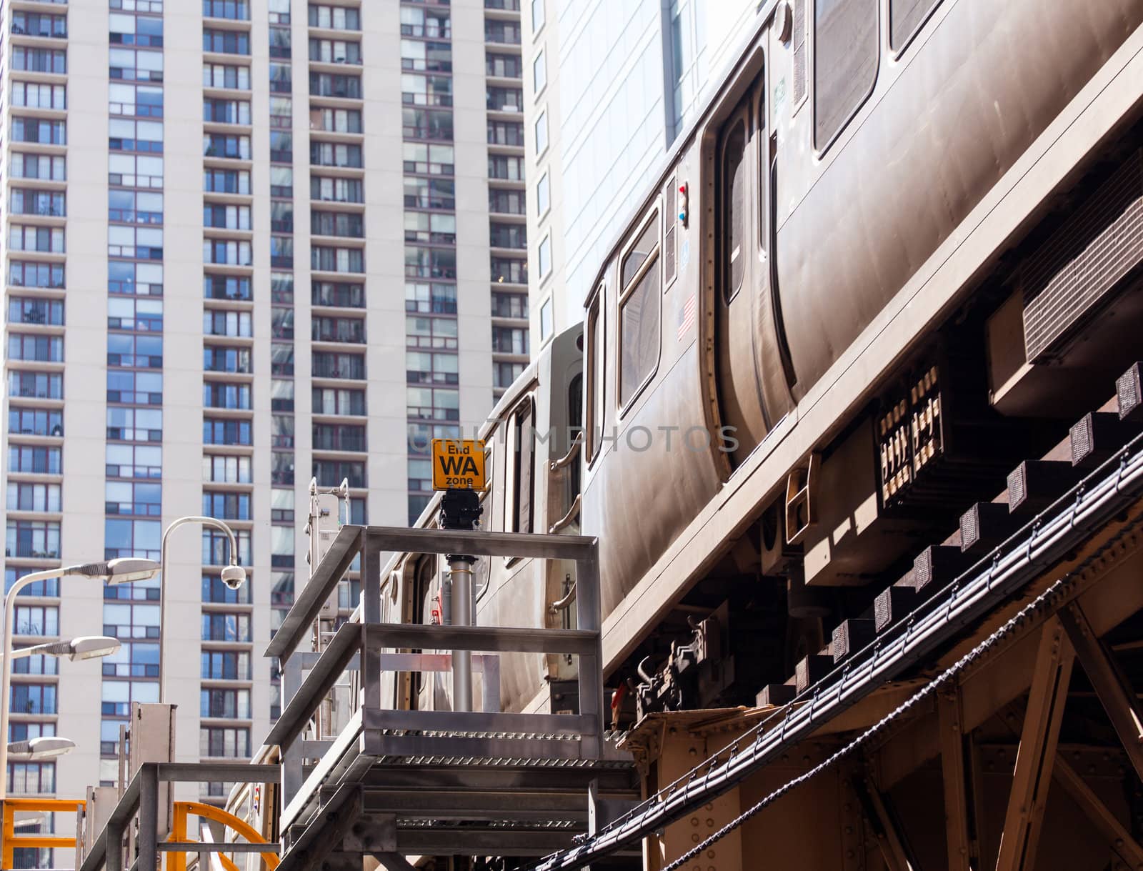 Chicago train on the overhead track of Loop with skyscrapers