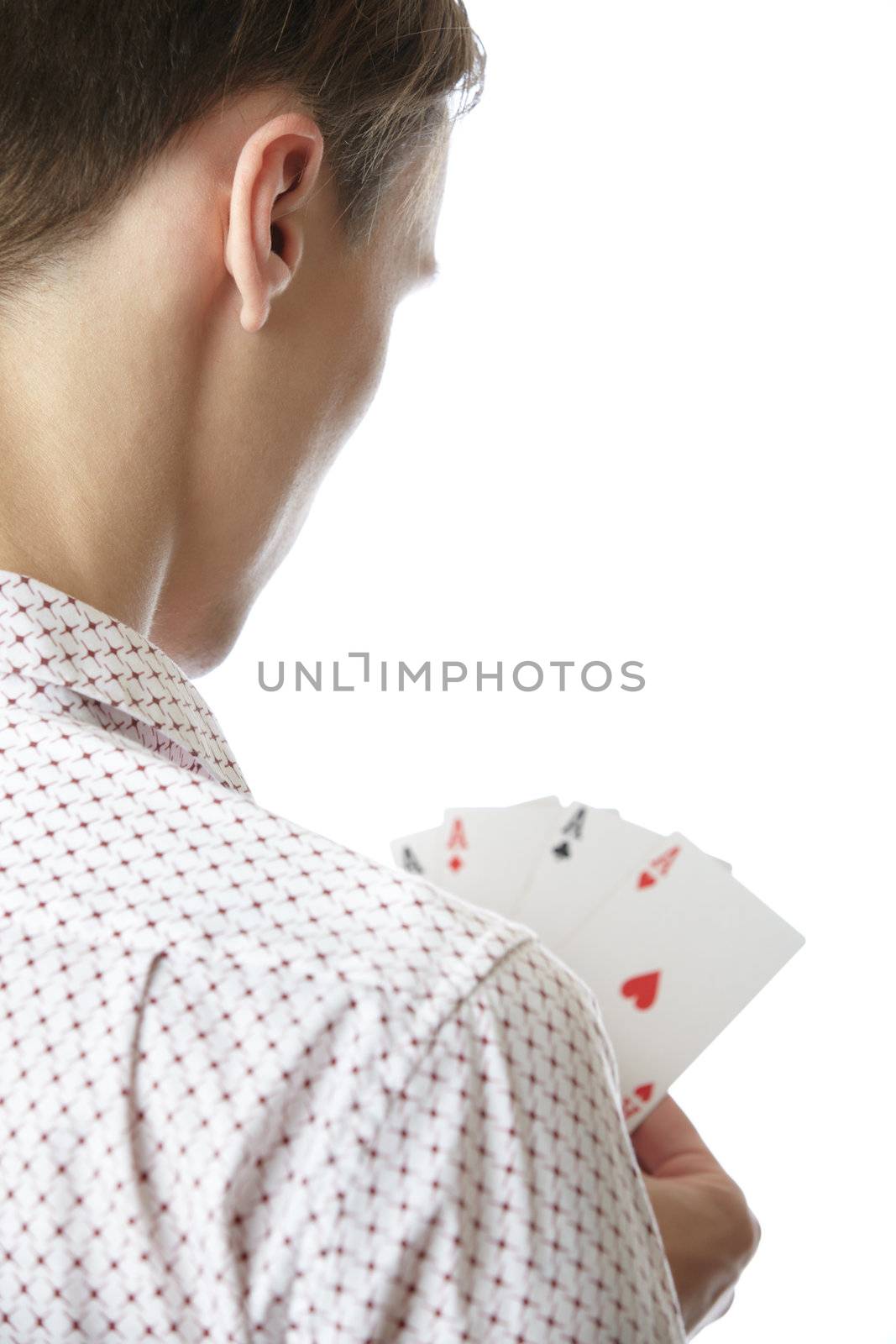 Man holding cards with Four of Aces. Rear view on a white background