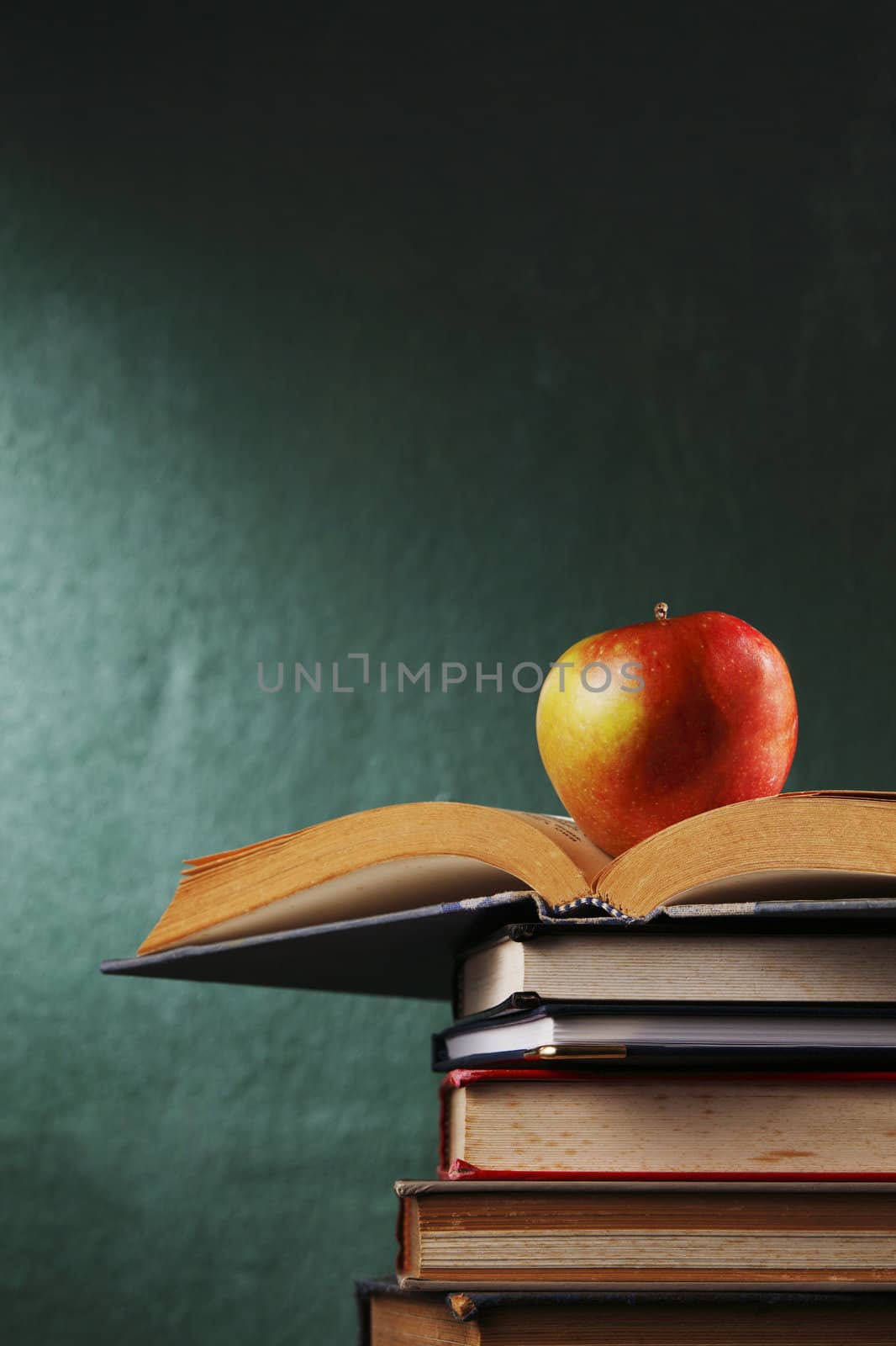 apple on stack of book