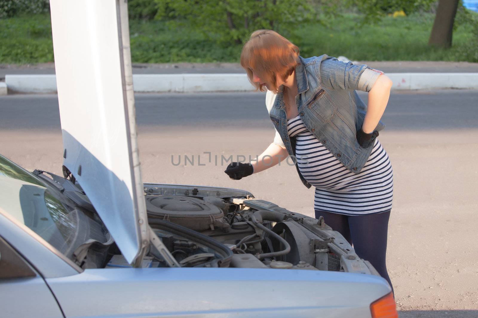 Pregnant Woman Trying to Repair the Car by Discovod