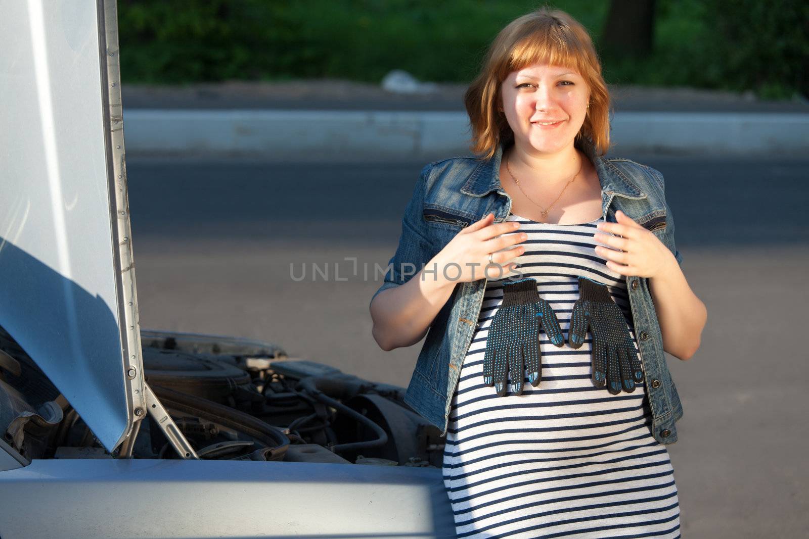 Pregnant Woman Near the Broken Car 