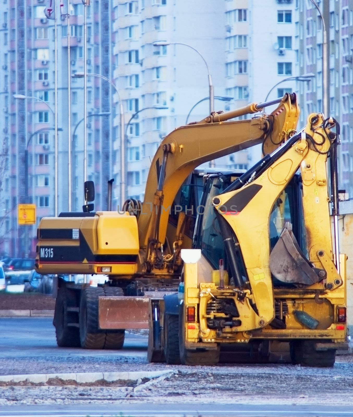 big yellow bulldozer on a construction site neighborhood