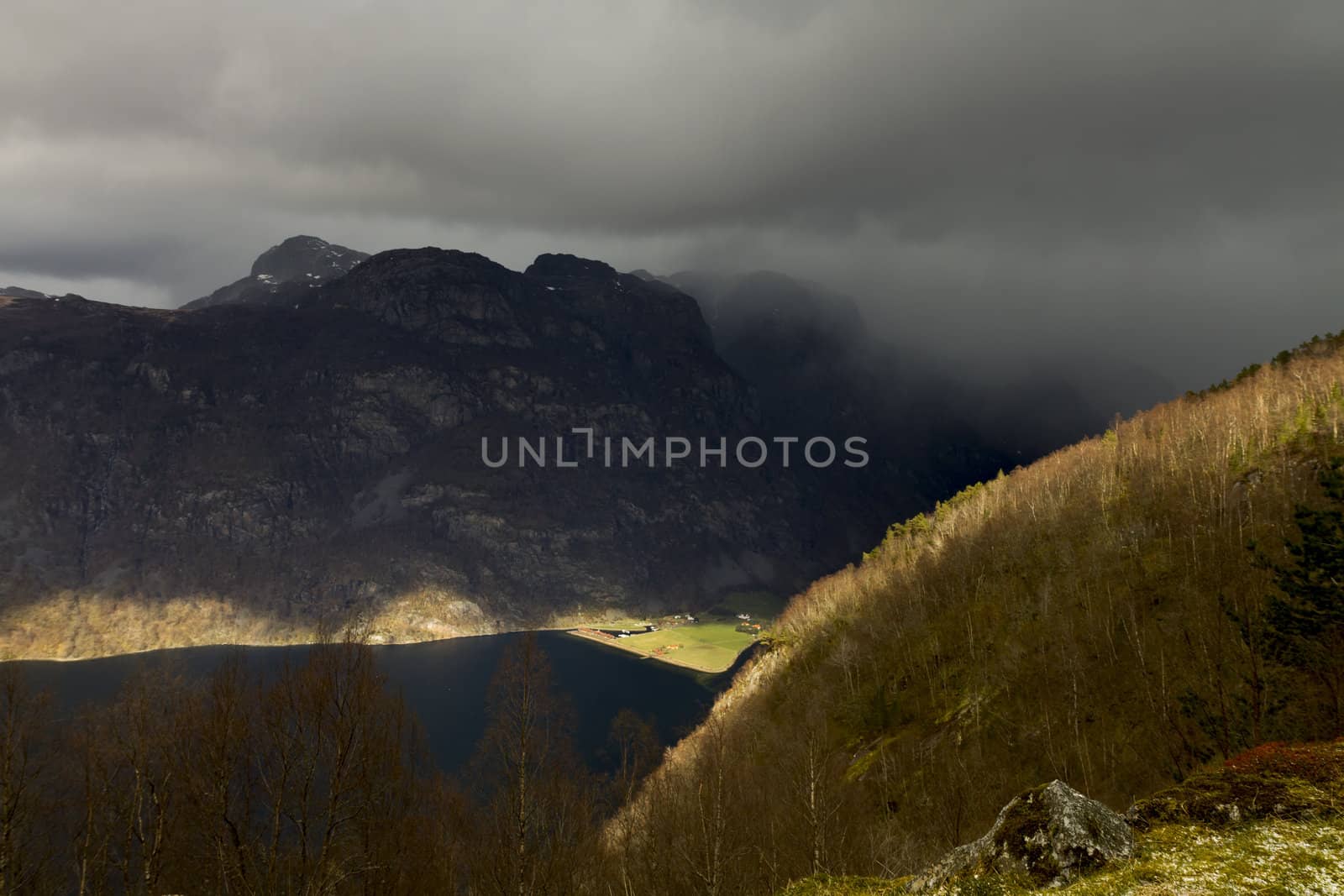 valley in norway in changeful weather by gewoldi