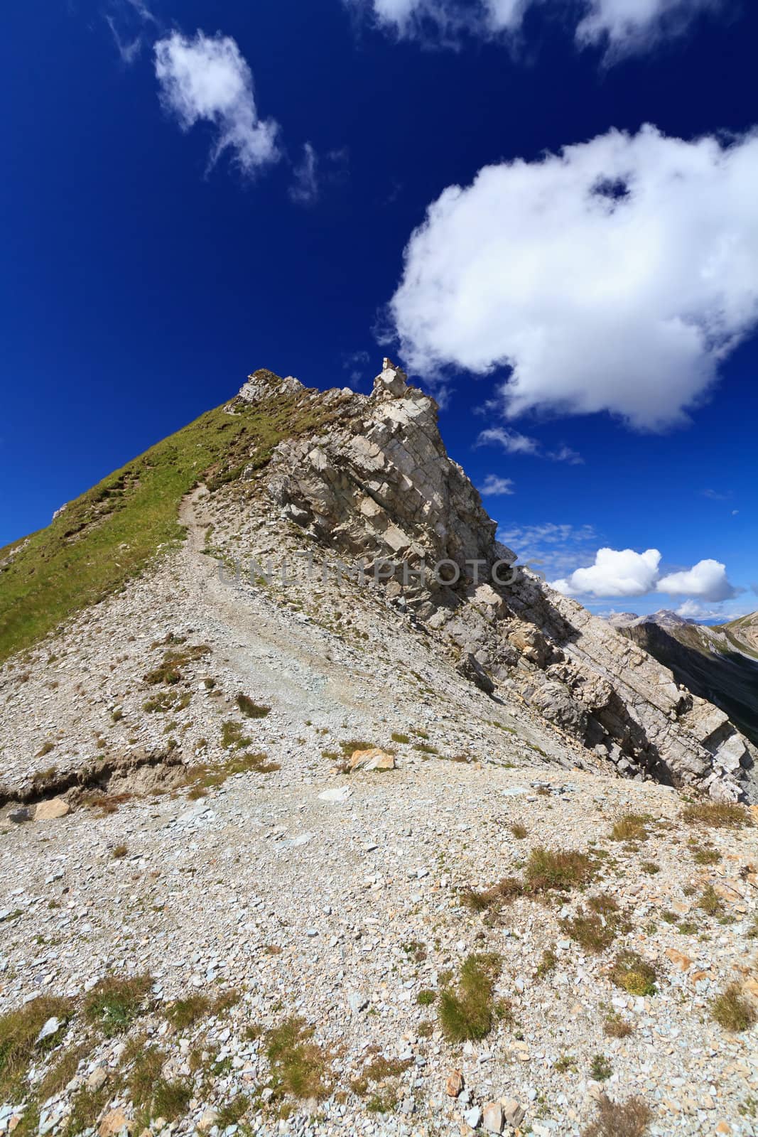 white clouds over mountain summit in Italian Dolomites
