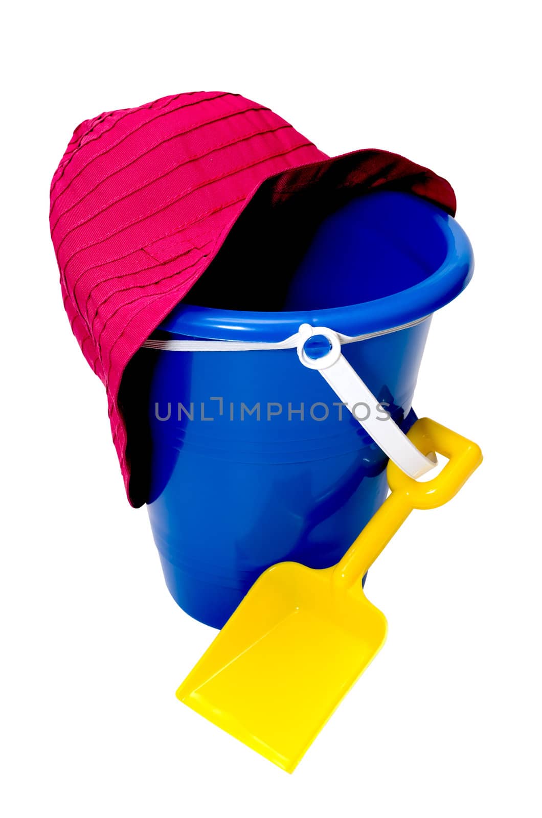 Beach toys isolated on white background with clipping path.  Sand pail, shovel, and beach hat.