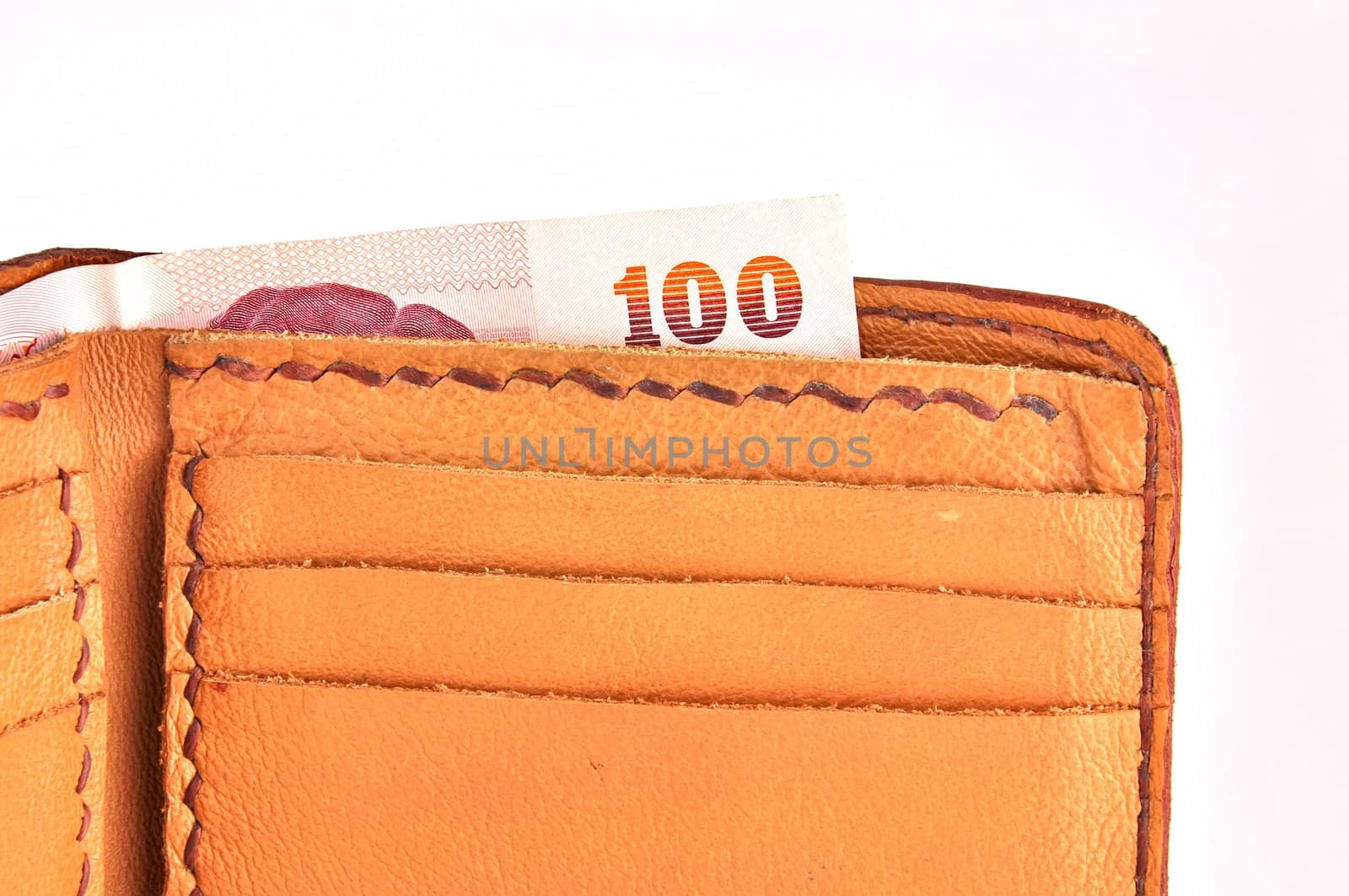 Open brown leather wallet with money 