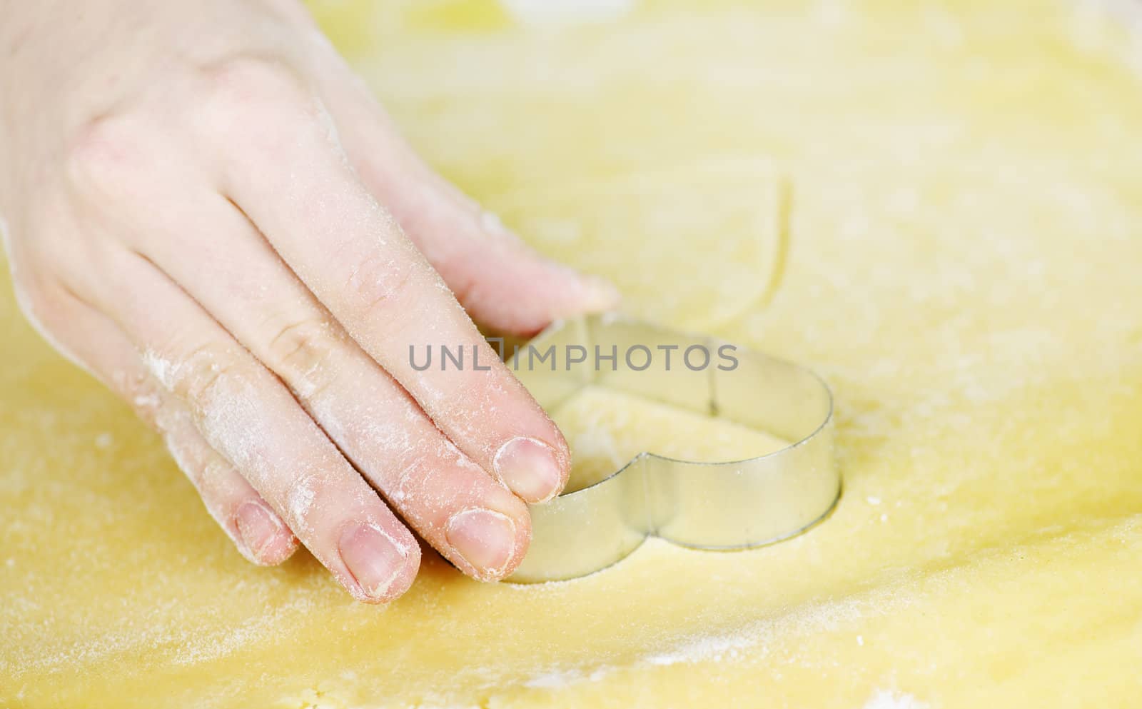 Making heart shaped shortbread cookies with cutters