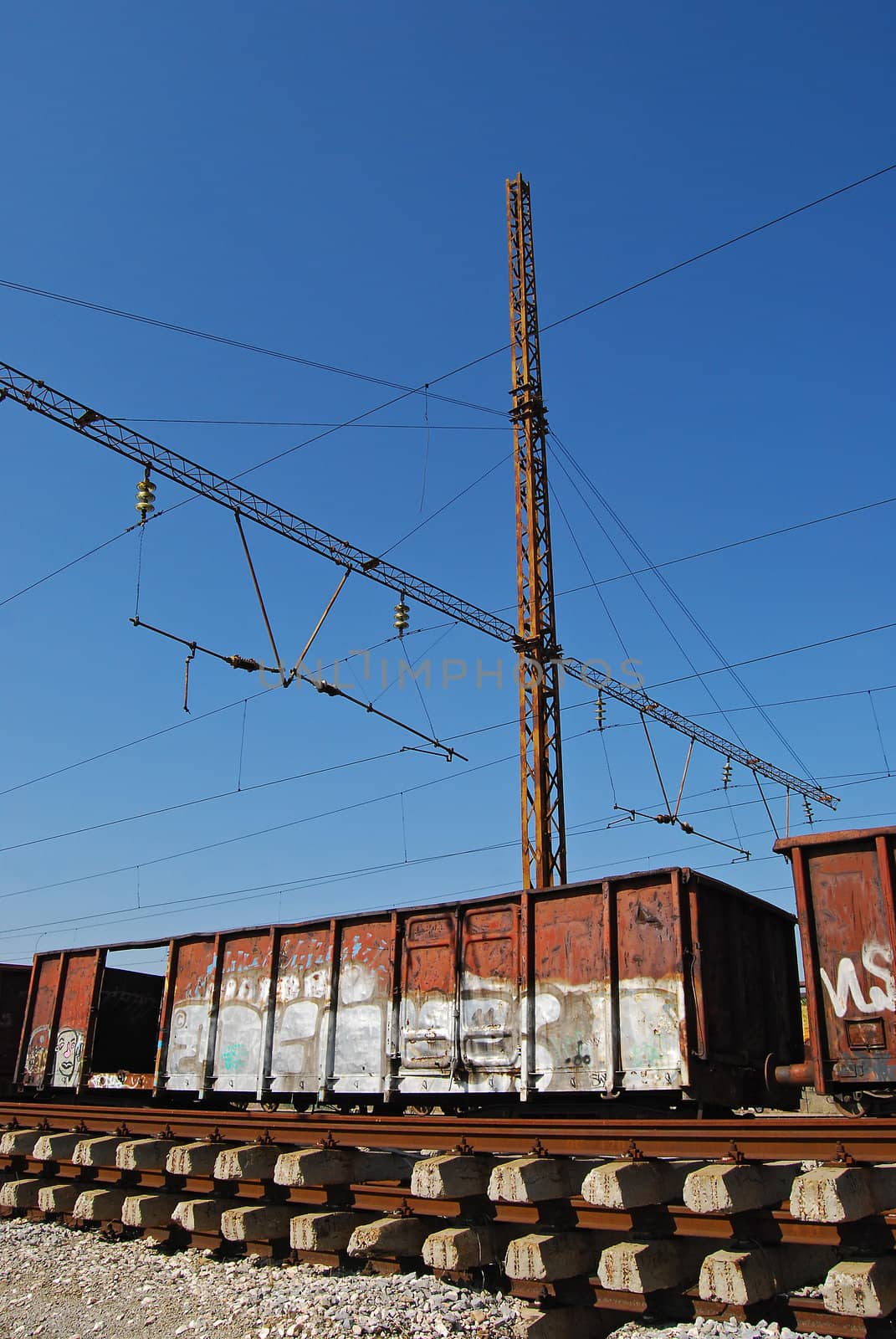 Grungy goods wagons, railways, sleepers, electrical supply