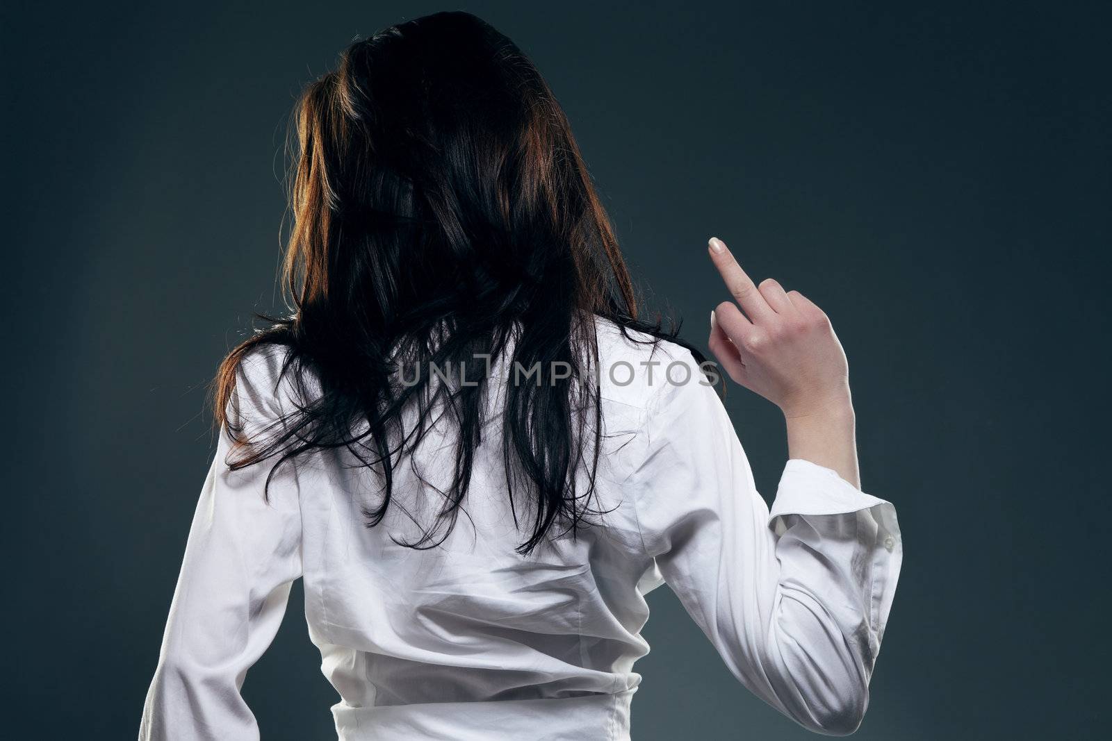 young woman from back showing the middle finger