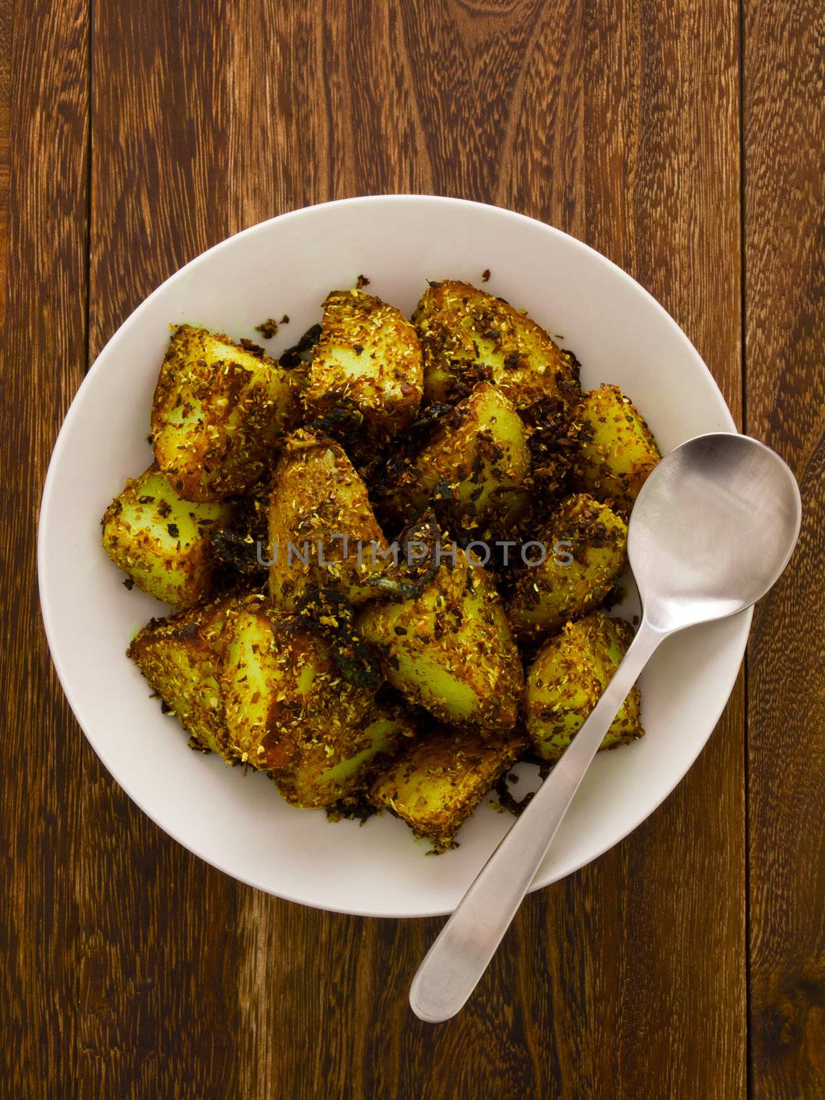 close up of a bowl of crusty baked potatoes