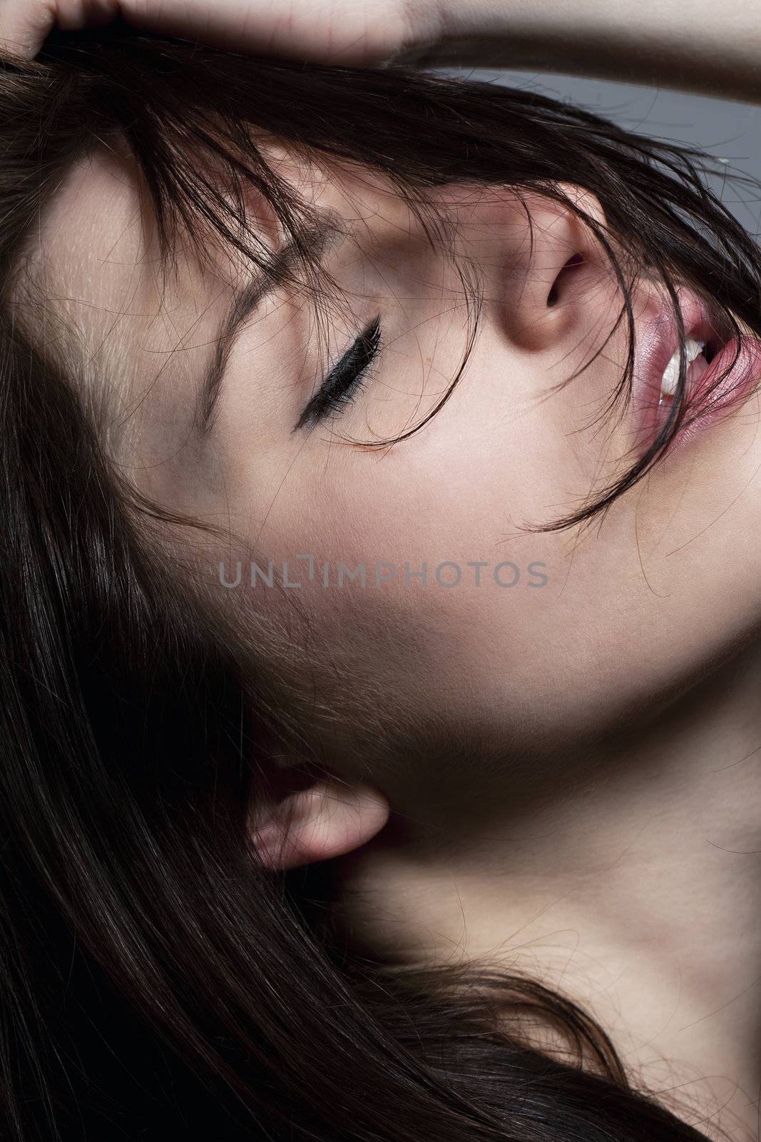 young sensual beautiful woman with closed eyes
