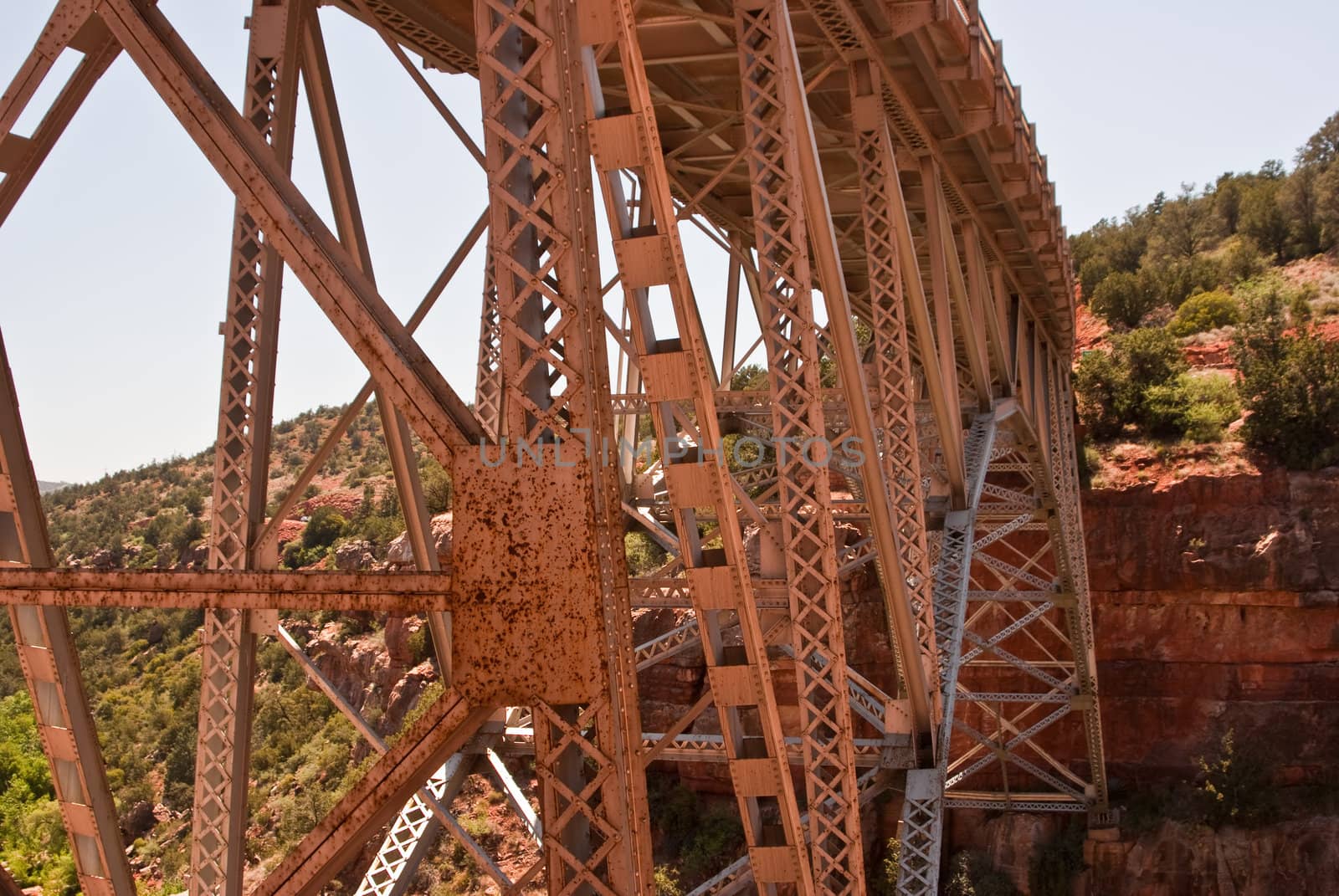 Rusted metal bridge spans Oak Creek Canyon, Arizona