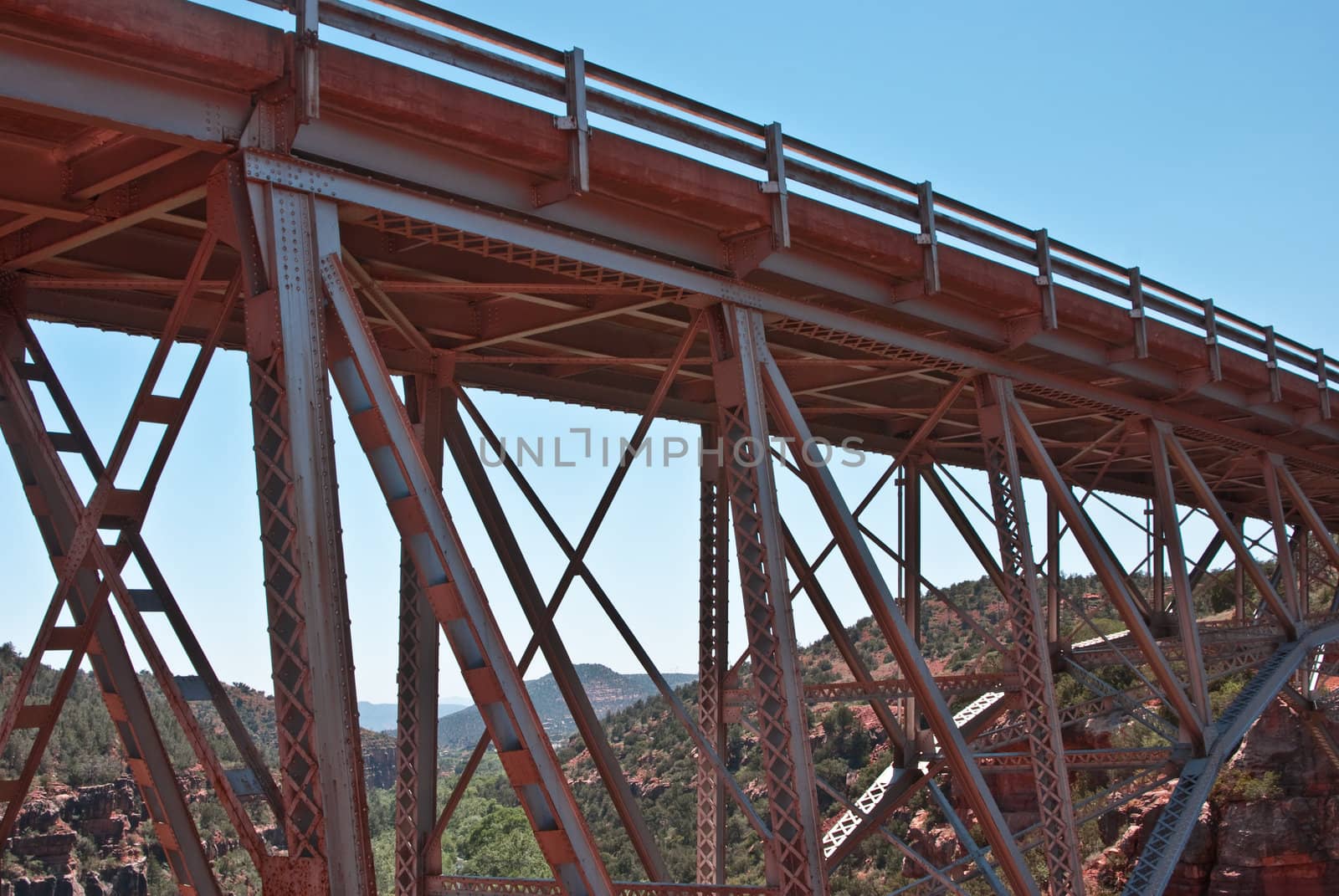 Rusted metal bridge spans Oak Creek Canyon, Arizona