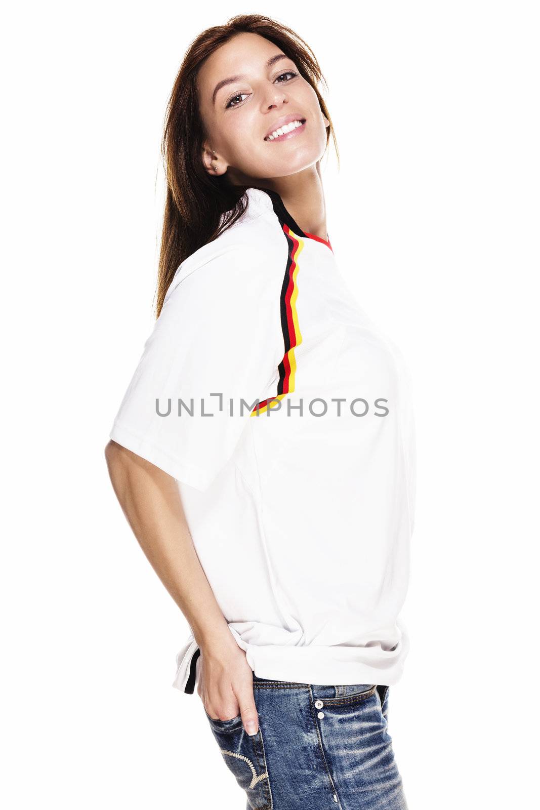 happy beautiful woman wearing football shirt with hand in her back pocket by RobStark