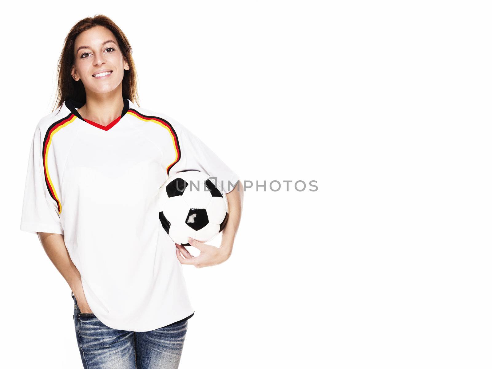 happy woman wearing football shirt holding football on white background